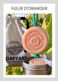 Savon avec corde Soapyard — Orange Blossom, sur fond illustrant son parfum