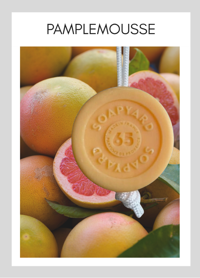 Savon avec corde Soapyard — Pamplemousse, sur fond illustrant son parfum